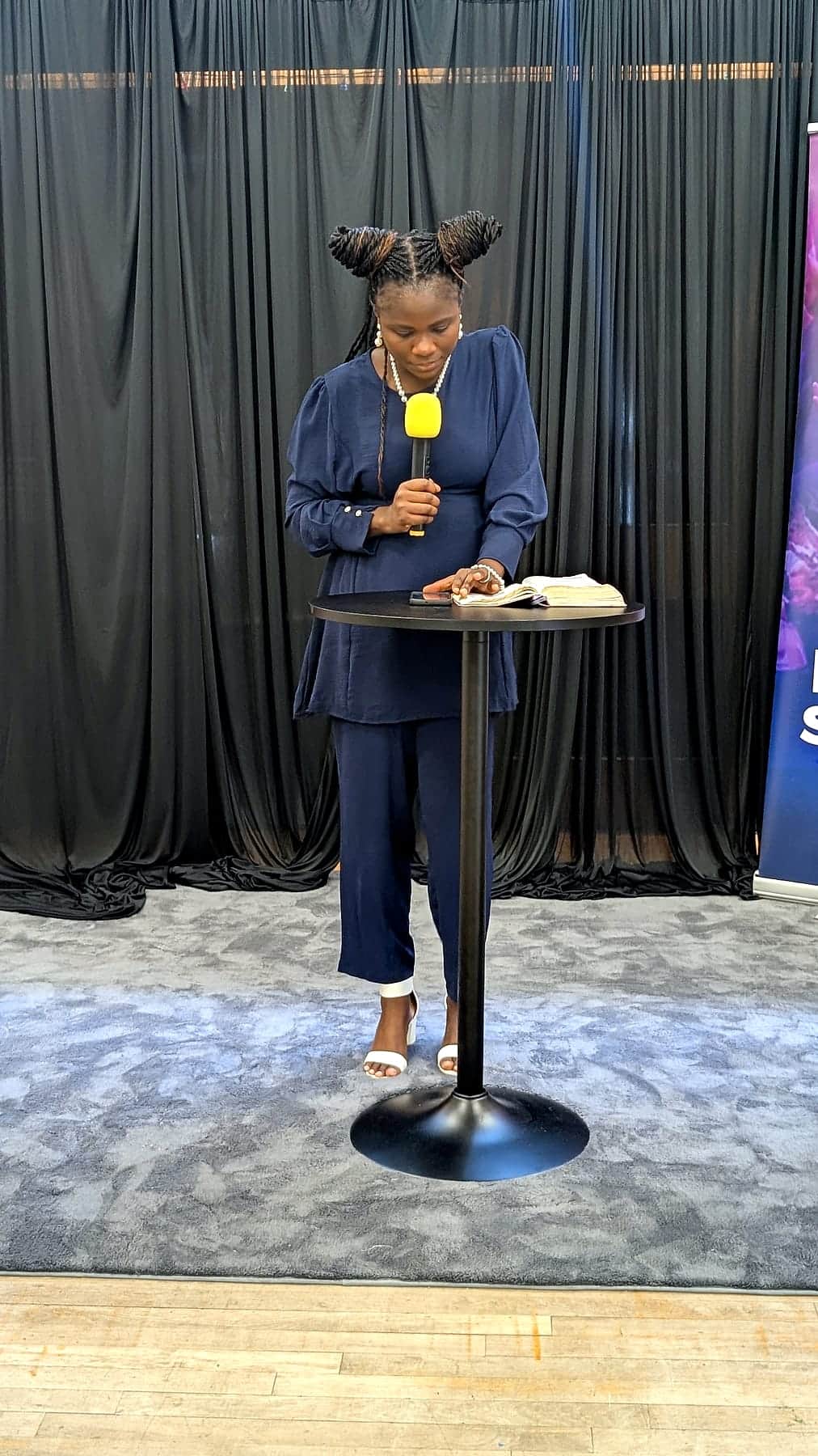 Speaking from the lectern at a BHCC service