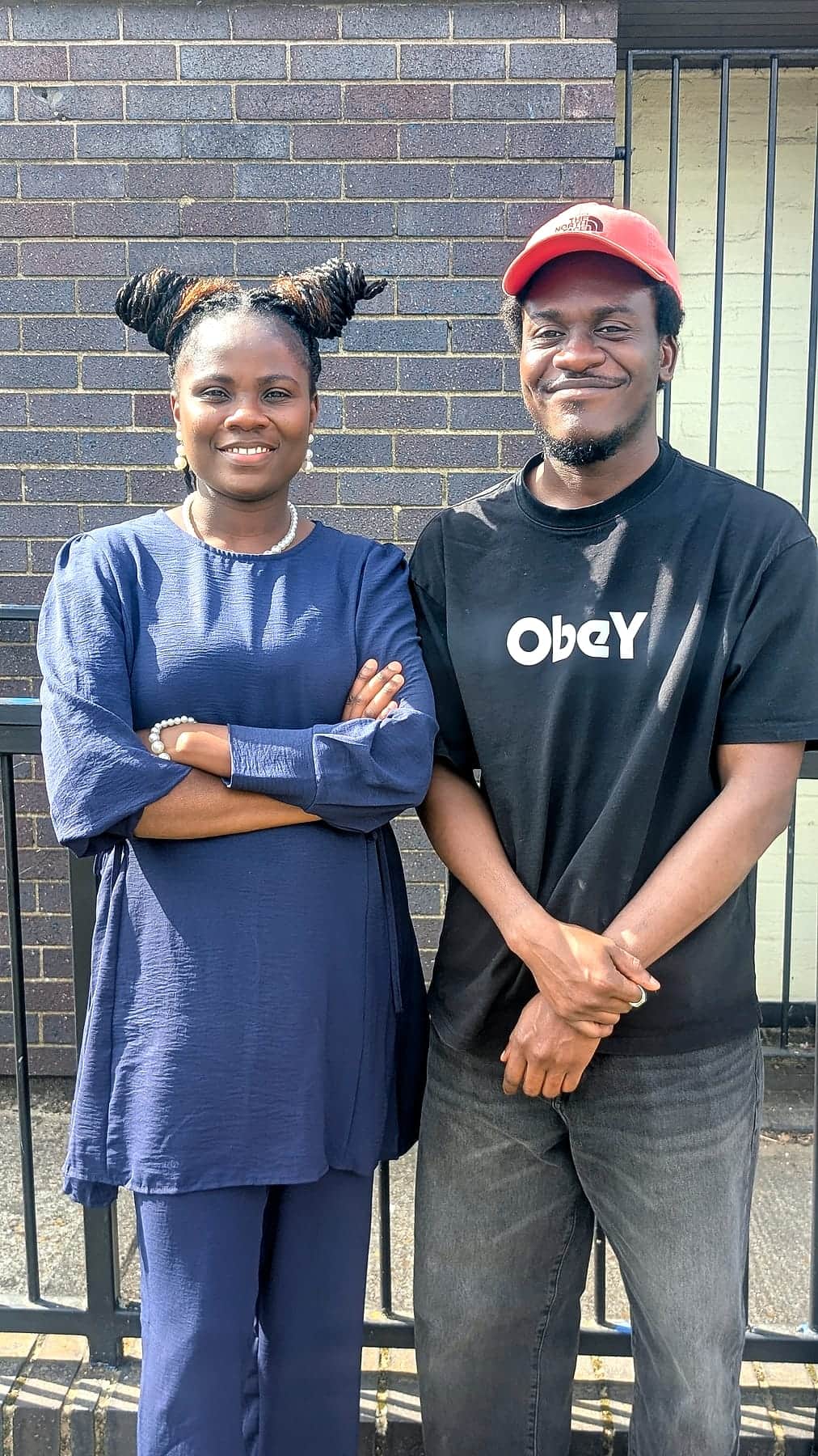 Two members of the BHCC congregation outside the centre