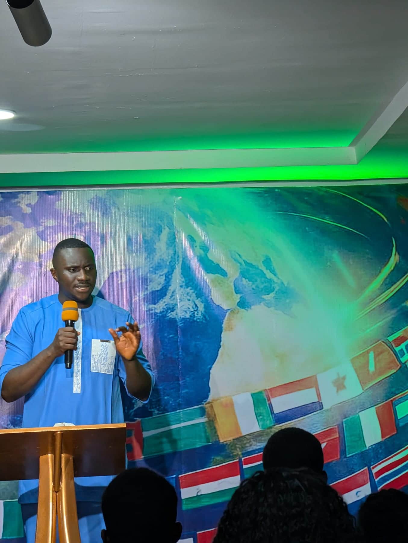 Preaching to the congregation at an evening BLCN service