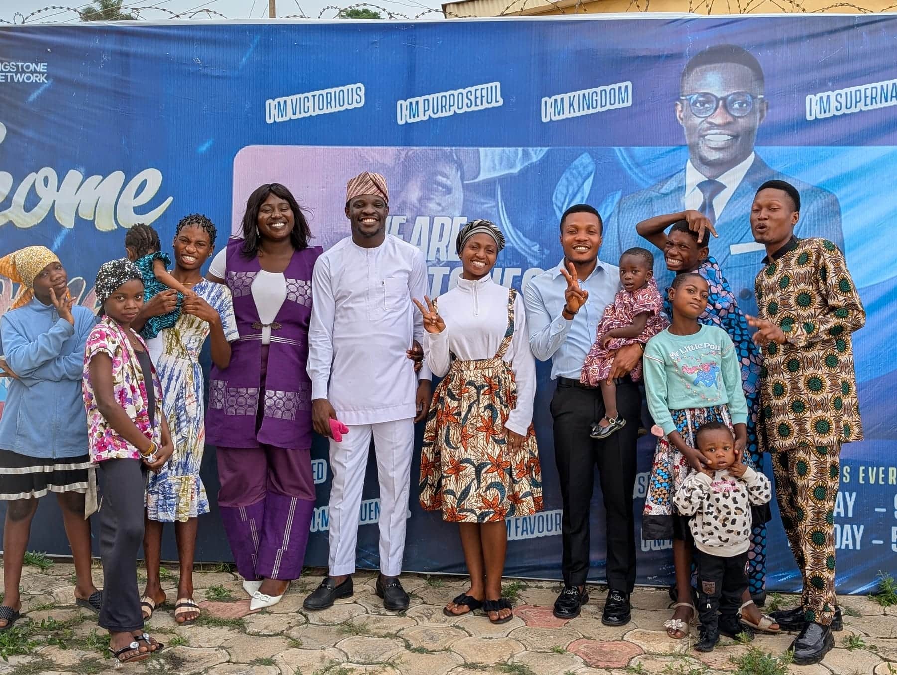 The BLCN family photographed together outside after a service