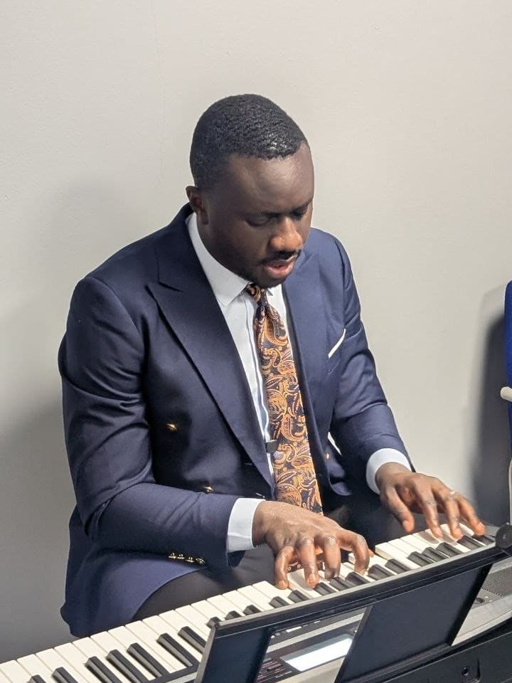 Pastor Ayodele Oladapo Awe at the keyboard